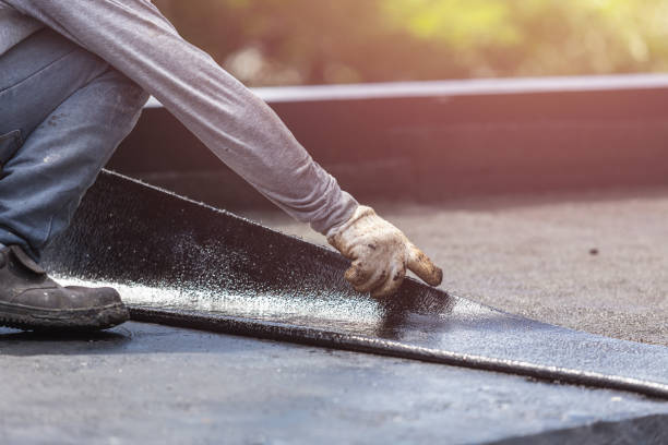 Professional Basement Waterproofing technician working in Marshall, IL